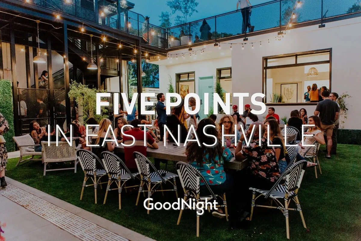 Depicts an outdoor scene where people are socializing on a stylish deck, surrounded by comfortable outdoor seating and illuminated by string lights. The modern architecture of the home is visible, and the joyful atmosphere suggests gatherings for events, dining outdoors, or celebrating under the stars.