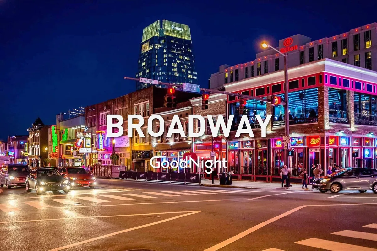 A bustling Nashville street illuminated by vibrant neon lights, with crowds of people enjoying various storefronts and the lively atmosphere. The scene captures the energetic nightlife and iconic entertainment culture the city is known for.