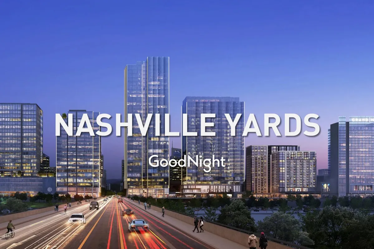 A vibrant exterior view showing Nashville's modern skyscrapers, a busy roadway, and pedestrians. The lively urban atmosphere is palpable, reflecting the city’s energy, business activity, and opportunities for networking and exploration.